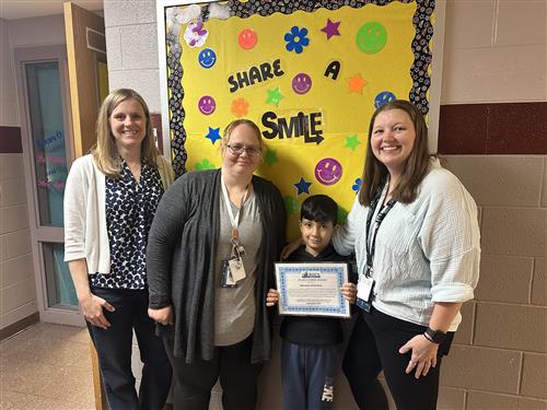 Mustafa Alibrahim, McKinley's Stairclimber for October, poses with his award plaque.